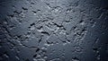 Textured Dark Gray Concrete Wall Surface with Deep Cracks and Dramatic Lighting Creating Shadows and Highlights Royalty Free Stock Photo
