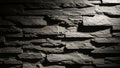 Textured dark grey stone wall with dramatic lighting and deep shadows creating a rugged surface Keywords: stone wall Royalty Free Stock Photo