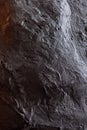 Textured dark surface with intricate patterns and natural variations Royalty Free Stock Photo