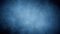Textured deep blue grunge background with subtle light gradient and dark vignette effect Royalty Free Stock Photo