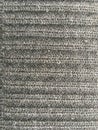 Textured embossed woolen fabric in gray. Abstract minimalistic background. Royalty Free Stock Photo