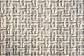 Textured fabric mat with woven wool beige yarn closeup shot