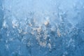 Textured frosty pattern on window lit by winter sun. Royalty Free Stock Photo
