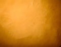 Textured golden background with subtle dark flecks and a soft gradient. Warm and earthy tones