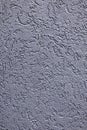Textured gray concrete wall surface with rough, irregular patterns suitable as a background Royalty Free Stock Photo