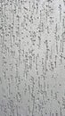 Textured gray concrete wall with vertical ridges and rough surface patterns Royalty Free Stock Photo