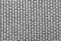 Textured gray fabric background showcasing intricate woven patterns, highlighting the craftsmanship and material quality Royalty Free Stock Photo