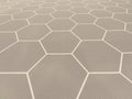 Textured gray hexagonal pattern of rubber tiles arranged with white lines for a modern, geometric flooring design. Royalty Free Stock Photo