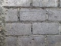 A textured gray surface formed by concrete blocks and mortar. Royalty Free Stock Photo