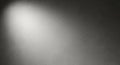 Textured Gray Wall with Dramatic Spotlight and Speckles concrete plaster Royalty Free Stock Photo