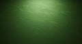 A textured green wall with a subtle gradient effect, showing variations in light and Royalty Free Stock Photo