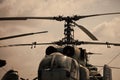 Textured grunge old helicopter and sky with clouds on background. Old helicopter not able to fly, stands in museum of