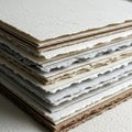 Of textured handmade paper sheets in various shades of white beige and Royalty Free Stock Photo