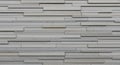 Textured Light Gray Stone Wall with Horizontal Rectangular Slat Pattern background Royalty Free Stock Photo