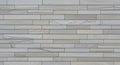 Textured Light Gray Stone Wall with Horizontal Rectangular Slat Pattern background Royalty Free Stock Photo