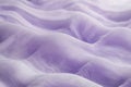 Textured lilac-toned sand dunes, soft rolling waves with fine granular details. Royalty Free Stock Photo