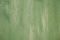 Textured metal surface carelessly colored green paint and faded in the sun in pale gray with rusty specks. Royalty Free Stock Photo