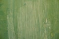 Textured metal surface carelessly colored green paint and faded in the sun in pale gray with rusty specks. Royalty Free Stock Photo