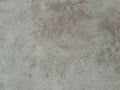 Textured neutral grey surface with reddish brown variations resembling stoneware or concrete, ideal for backgrounds, rustic design Royalty Free Stock Photo