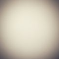 A textured off-white background with subtle lighting effects, creating a vignette effect Royalty Free Stock Photo