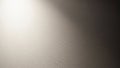 Textured off-white wall surface with a soft gradient of light and shadow creating a subtle, minimalist background with a gentle Royalty Free Stock Photo