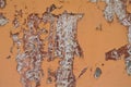 textured orange wall background with peeling paint Royalty Free Stock Photo