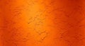 A textured orange wall features an uneven plaster finish. The surface displays Royalty Free Stock Photo