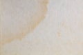 Textured paper with coffee stain on light surface Royalty Free Stock Photo