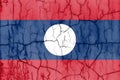 Textured photo of the flag of Laos with cracks.