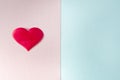 The textured pink and blue background is divided into equal parts. The pink part has a red heart.