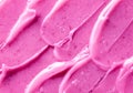 Textured pink smears of cream