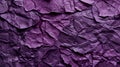 Textured purple crumpled paper fills the frame with a rich play of shadows and depth