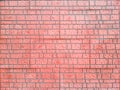 Textured red decorative ceramic tile for facade cladding Royalty Free Stock Photo