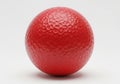 Textured red egg shaped stress ball isolated on white background Royalty Free Stock Photo