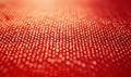Textured red fabric surface, intricate weave pattern, soft sheen, warm tones, close-up view