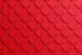 Textured red surface with repeating scale pattern Royalty Free Stock Photo