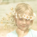 Textured Retro Portrait of Pretty Little Blonde Girl with a Crown of Daisies
