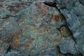 Textured rock fragment of different rocks with cracks and lichen Royalty Free Stock Photo