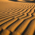 Textured sand forms graceful, parallel lines influenced by wind, creat Royalty Free Stock Photo