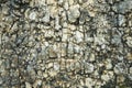 Textured stone background Rubble ballast in natural form in the rock wall