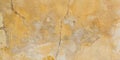 Textured stone sandstone surface yellow concrete wall brown old plaster chipped texture background Royalty Free Stock Photo