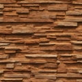 Textured stone wall with brown brickwork