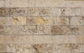 Textured stone wall close-up. The background. Limestone. Royalty Free Stock Photo