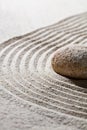 Textured stone on waves for concept of relaxation Royalty Free Stock Photo