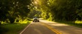 Textured surface, background green countryside landscape on sunny day, truck driving on desert highway Royalty Free Stock Photo