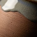 Textured surface of a ceramic object with two distinct layers Royalty Free Stock Photo
