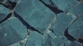Textured surface of cracked black slate stone for natural design elements Royalty Free Stock Photo