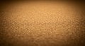 A textured surface of fine, granular cork particles is shown, with a close-up view Royalty Free Stock Photo