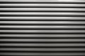 textured surface of a grooved metal roller door