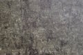 Textured surface resembling natural stone with variations in gray tones and subtle patterns visible under light Royalty Free Stock Photo